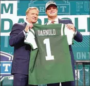  ?? TOM PENNINGTON / GETTY IMAGES ?? Former USC QB Sam Darnold poses with NFL Commission­er Roger Goodell (left) after being selected third overall by the Jets in the NFL draft last month.