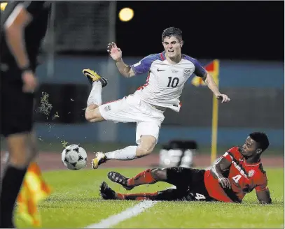  ?? Rebecca Blackwell ?? The Associated Press Christian Pulisic (10), shown being fouled by Trinidad and Tobago’s Kevon Villaroel during a World Cup qualifier Tuesday in Couva, Trinidad, is already the best American player at 19 years old, and will lead the national team’s...