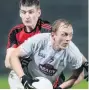  ??  ?? FOCUSED: Kildare’s Keith Cribbin beats Conor Maginn