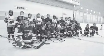  ?? [ALI WILSON / THE OBSERVER] ?? The Novice Rep B and Novice LL#2 teams were out skating around following their season last Monday. The Woolwich Wild organizati­on will be putting on a Come and Try Girls Hockey event at 4 p.m. on April 15 at the Woolwich Memorial Centre.