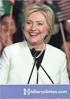  ?? RICARDO ROLON, THE NEWS-PRESS ?? Democrat Hillary Clinton addresses supporters Tuesday evening at the Ice Palace Film Studios in downtown Miami.