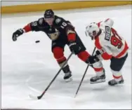  ?? REED SAXON — THE ASSOCIATED PRESS ?? Flyers winger Jake Voracek, right, and Anaheim Ducks right winger Corey Perry do a little puck racing last Saturday night in Anaheim.