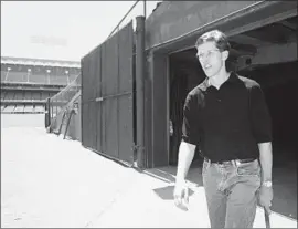  ?? Nick Ut Associated Press ?? OREL HERSHISER, leaving Dodger Stadium after the strike began, didn’t return the next season and wouldn’t play for them again until the end of his career.