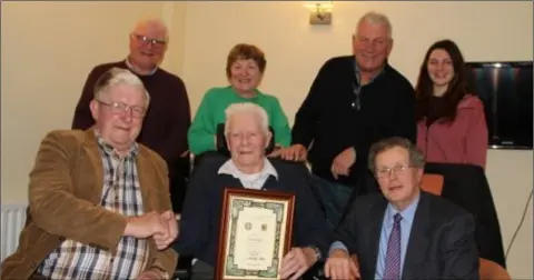  ??  ?? Michael Lyons, who was born in Ballygulle­n, Craanford, 94 years ago, was honoured recently for his services to the Gaelic Athletic Associatio­n by the Seana Ghael Loch Garman committee. Back (from left) Ger Lyons (son), Elizabeth Fagan (daughter), Michael Lyons (son), Chloe Lyons (grand-daughter). Front (from left): Dan Kennedy (committee), Michael Lyons, Michael Foley (Chairman).