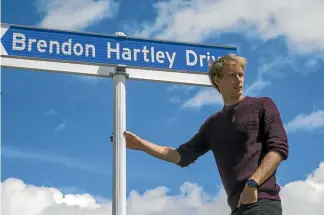  ?? MURRAY WILSON/STUFF ?? New Zealand Formula 1 driver Brendon Hartley at the entrance to Manawatu’s Manfield circuit, now named after him.