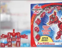  ?? AP PHOTO ?? Bakugan 7-in-1 Maxus Helios, from Spin Master, is shown in New York in 2009. Canadian toy maker Spin Master Corp. has filed a patent suit in California against Mattel, Inc., claiming Mattel’s transformi­ng Mecard cars infringe on at least two of the...