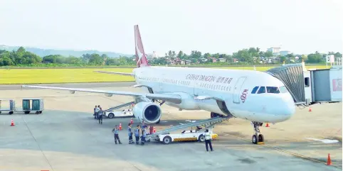  ??  ?? Cathay Dragon A320 at the Davao Internatio­nal Airport. It arrived &amp; departed on schedule.