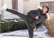  ?? ?? FAR LEFT: Khaya Mjumbe, 14, who does martial arts, demonstrat­es a kick at Tuley Park in the Chatham neighborho­od.