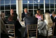  ?? CAROLYN KASTER — THE ASSOCIATED PRESS ?? President Donald Trump sits with first lady Melania Trump as he meets with business leaders, Tuesday at Trump National Golf Club in Bedminster, N.J.