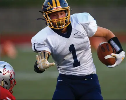  ?? DAVID C. TURBEN — FOR THE NEWS-HERALD ?? Kirtland’s Mason Sullivan plows toward the end zone during the Hornets’ 30-0 win over Geneva on Sept. 13 at SPIRE Institute.