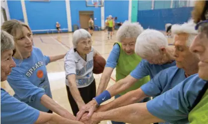  ?? Photograph: ESPN ?? The Splash, with their coach CJ Moloney (second left), prepare for a training session.