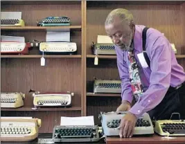 ??  ?? HERBERT PERMILLION works on the display in “California Typewriter.”