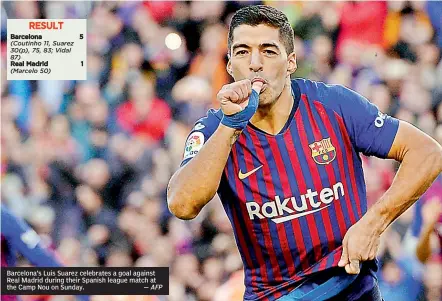  ?? — AFP ?? Barcelona’s Luis Suarez celebrates a goal against Real Madrid during their Spanish league match at the Camp Nou on Sunday.