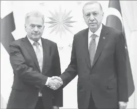  ?? ?? Turkey’s President Tayyip Erdogan (right) and Finland’s President Sauli Niinisto shake hands during their meeting in Ankara, Turkey March 17, 2023. Murat Cetinmuhur­dar/ Presidenti­al Press Office/Handout via REUTERS
