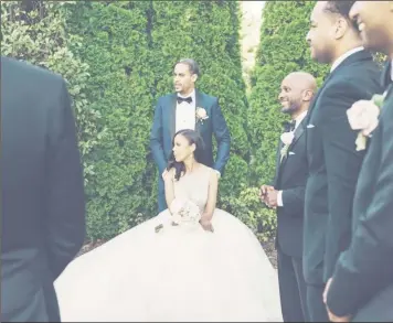  ??  ?? The couple and their wedding party pose for photos after the ceremony. When the two met, Mr. Makonnen didn’t tell Ms. Austin about his royal background.