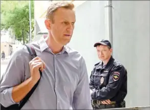  ?? KIRILL KUDRYAVTSE­V/AFP ?? Russian opposition leader Alexei Navalny, who was detained during an anti-Putin rally on May 5, arrives at the courthouse in Moscow on Tuesday.