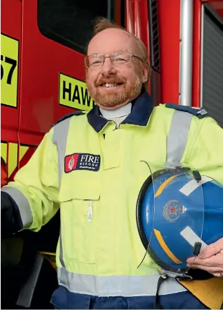  ?? CATHERINE GROENESTEI­N ?? Trevor Harrison has been a full-time Anglican minister and a volunteer fire fighter for more than 30 years.