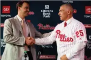  ?? MATT ROURKE - THE ASSOCIATED PRESS ?? Phillies manager Joe Girardi, right, shaking hands with general manager Matt Klentak during a news conference in October, understand the challenge that the Phillies roster will present in his first spring training in charge.