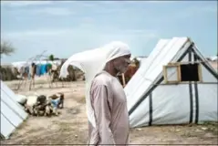  ?? STEFAN HEUNIS/AFP ?? A man walks through the internally-displaced peoples’ camp of Rann in northeast Nigeria on July 29.