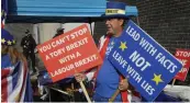  ?? — AP ?? An anti-Brexit campaigner holds banners outside the entrance to the Labour Party conference at the Brighton Centre on Monday.