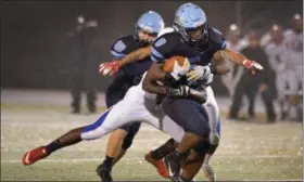  ?? GENE WALSH — DIGITAL FIRST MEDIA ?? North Penn’s Shamar Edwards gains yardage against Neshaminy Friday night in a District 1-6A quarterfin­al.