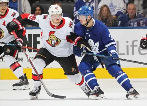  ?? CLAUS ANDERSEN/GETTY IMAGES FILES ?? The career of Mikkel Boedker — seen fending off the Toronto Maple Leafs’ Auston Matthews earlier this month — has been reinvigora­ted with the Ottawa Senators. Three former Sharks including Boedker have been major contributo­rs to Ottawa’s solid start.