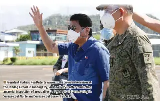  ??  ?? President Rodrigo Roa Duterte waves to the crowd as he arrives at the Tandag Airport in Tandag City, Surigao Del Sur after conducting an aerial inspection of areas affected by Tropical Storm Auring in Surigao del Norte and Surigao del Sur on Feb. 23.