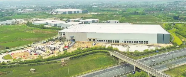  ??  ?? ●●Land at Kingsway Business Park is being developed as part of ambitious plans that could bring new jobs to Rochdale