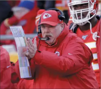  ?? CHARLIE RIEDEL — THE ASSOCIATED PRESS ?? Kansas City Chiefs head coach Andy Reid calls a play during the first half of the AFC Championsh­ip Game Sunday. Reid is headed back to the Super Bowl thanks to a 35-24 win over Tennessee.