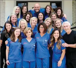  ?? SUBMITTED PHOTO ?? John Daniel, lower right, poses with his well-trained and profession­al staff at Daniel Orthodonti­cs. Daniel said his staff’s quality work leads to his success.