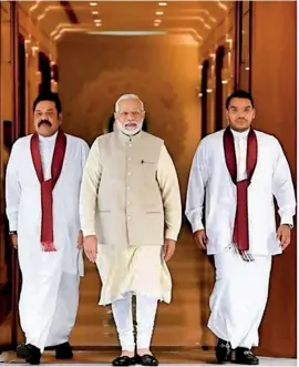  ??  ?? THE FATHER, THE SON AND THE HOLY MODI: Swami Subramania­n sponsored freebie passage to India to showcase Namal as heir apparent to head the Rajapaksa dynasty