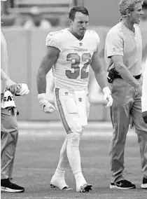  ?? JOHN MCCALL/SOUTH FLORIDA SUN SENTINEL ?? Dolphins running back Patrick Laird walks off the field on Sunday.