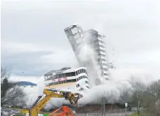  ?? — Reuters ?? The Bonn Center topples during a controlled demolition in Bonn, Germany, on Sunday.