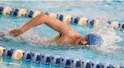  ?? [PHOTO BY JOEY JOHNSON, FOR THE TULSA WORLD] ?? Stillwater’s Jackson Tidland swims in the 400-yard freestyle relay on Monday during the All-State meet in Bartlesvil­le.