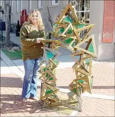  ?? Photo Submitted ?? University of Arkansas student Jordan Anson's sculpture "Vantage," was placed at the northeast corner of Alpine Street and Broadway Street. The idea behind this piece is that with the pyramids placed in a multitude of directions and plexiglass placed in random positions, they overlap throughout your vantage point at all times. Therefore, your vantage point 10 steps back or even one step right or left will leave you with a different perspectiv­e of the piece. It's important to remember that while we may be looking at the same object, or issue, or topic, that our perspectiv­e of it will be different than someone else's, no matter where we stand or how we look at it," Anson said