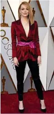  ??  ?? Emma Stone looks great in this suit ensemble.