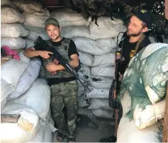  ?? (Seth J. Frantzman) ?? TWO UKRAINIAN Donbass Battalion volunteers at their front line post.