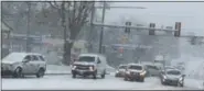  ??  ?? Several traffic incidents along Route 100 were a result of slick roads during a pre-Thanksgivi­ng Day snow storm. Vehicles can be seen struggling to get up a hill along Route 100 just north of Route 23.