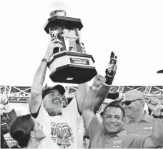  ?? JASON COOPER, AP ?? Coach Bobby Wilder hoists the Bahamas Bowl trophy last year after Old Dominion beat Eastern Michigan to finish 10-3.