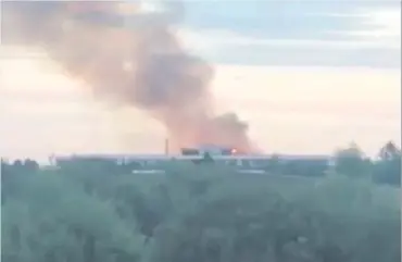  ??  ?? Smoke rises from the former St Patrick’s Academy building in Dungannon last night