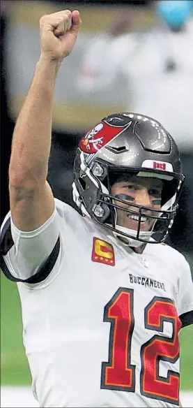  ?? GETTY IMAGES FILE ?? Buccaneers quarterbac­k Tom Brady celebrates a first down against the New Orleans Saints late in the fourth quarter of an NFC divisional playoff game on Sunday in New Orleans.