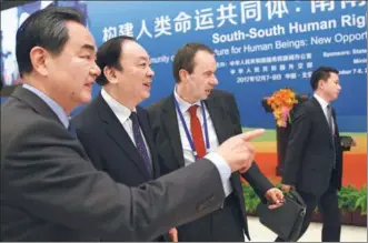  ?? ZOU HONG/ CHINA DAILY ?? Foreign Minister Wang Yi (from left), Huang Kunming, head of the CPC Central Committee’s Publicity Department, and Tom Zwart, director of Vrije University Amsterdam’s Cross-Cultural Human Rights Centre, attend the South-South Human Rights Forum, which...