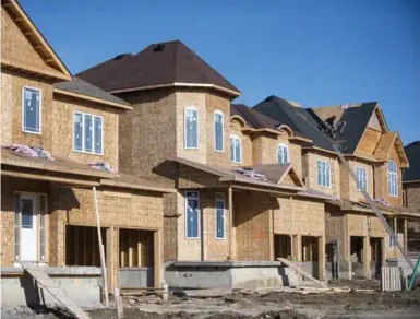  ?? ANDREW LAHODYNSKY­J FOR THE TORONTO STAR ?? The seasonally adjusted housing starts rate reached 253,720 units in March, according to the CMHC, which topped economists’ estimates of 215,000.