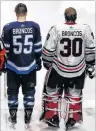  ?? CP PHOTO ?? Winnipeg Jets and the Chicago Blackhawks wore Broncos on the backs of their jerseys to honour the bus crash victims before their NHL game in Winnipeg on Saturday.