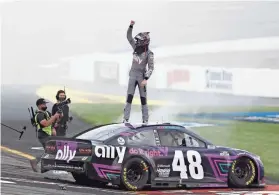  ??  ?? Alex Bowman celebrates after winning the Toyota Owners 400 on Sunday at Richmond Internatio­nal Raceway. AMBER SEARLS/USA TODAY SPORTS