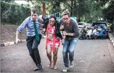  ?? LUIS TATO / AFP ?? People flee a commercial complex in Nairobi, Kenya, on Tuesday during an attack by extremists.