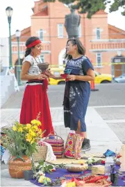  ?? Jerry Lara / Staff photograph­er ?? Standing by an altar, Amelia Romo Olivas, left, and Stephanie Rodriguez hold incense burners during SanArte En El West Side community health clinic, which featured traditiona­l native medicine at Guadalupe Plaza on Sunday. The series of clinics could return next year, possibly at another location.