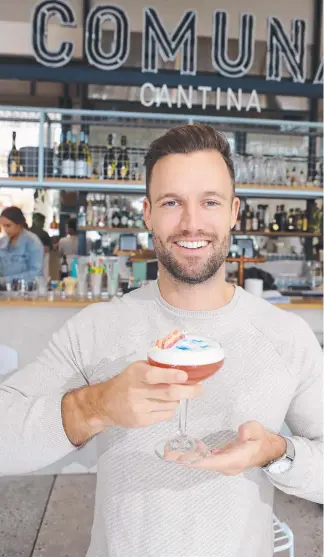  ?? Picture: RICHARD GOSLING ?? Fresh from his win at the Brisbane Young Entreprene­ur of the Year awards, Comuna Cantina owner Tim Johnson is about to launch a bubblegum sour cocktail.