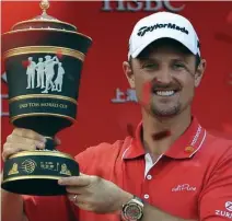  ??  ?? Justin Rose poses with the WGC-HSBC Champions trophy after a dramatic final day. (AFP)