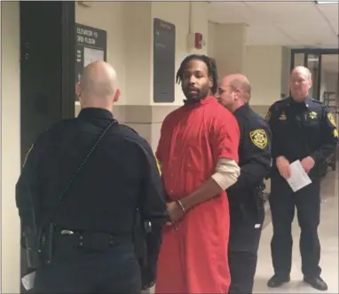  ?? CARL HESSLER JR. - DIGITAL FIRST MEDIA ?? Jonathan Wesley Harris, 31, is escorted from a Montgomery County courtroom after he pleaded not guilty at his formal arraignmen­t on charges in connection with the alleged Aug. 22 strangulat­ion death of Christina Rose Kraft, 36, inside her Ardmore residence.